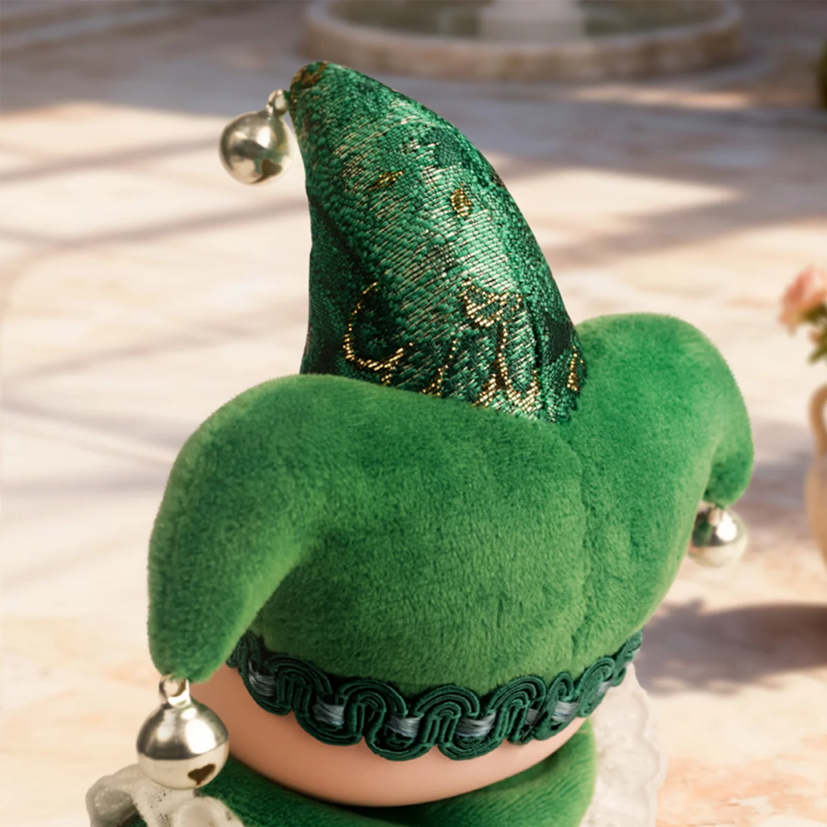 Back view of green Acceptance Angel jester hat and braided trim, Lulu The Piggy Triangel
