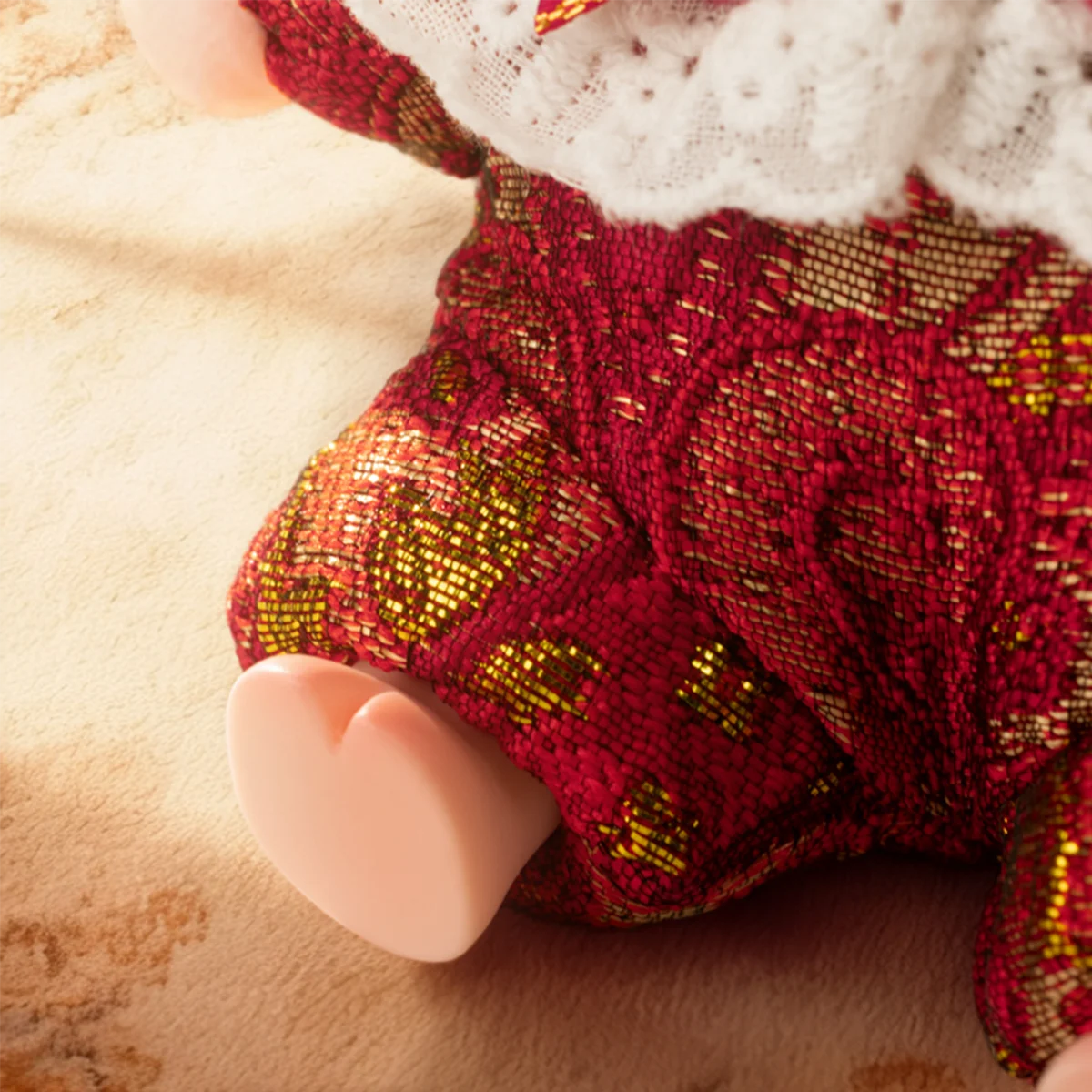 Close-up of crimson Passion Angel romper with gold floral pattern, Lulu The Piggy Triangel