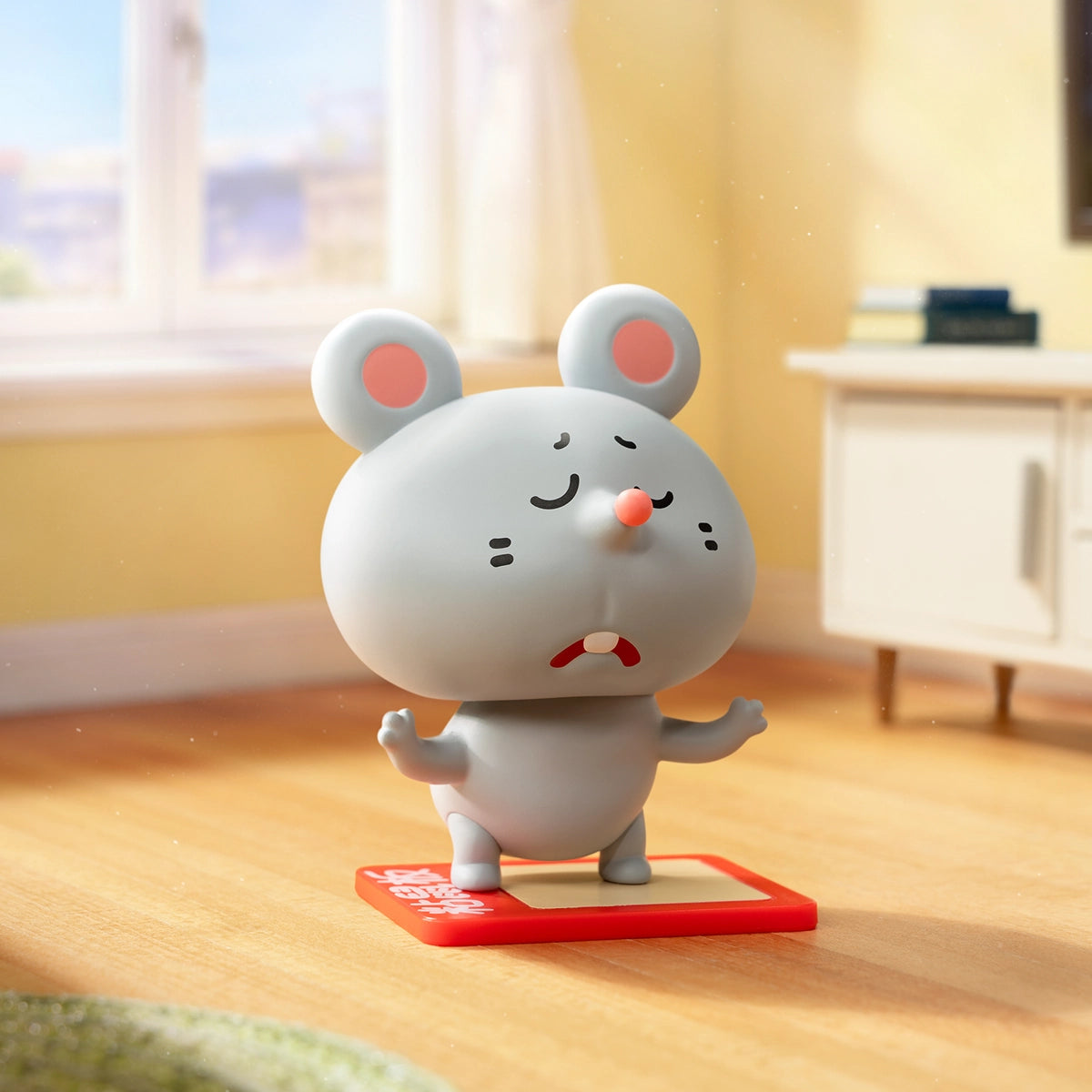 Grey mouse balancing on a red card with a glum face, Meiji and Dashu Blessed Mental State