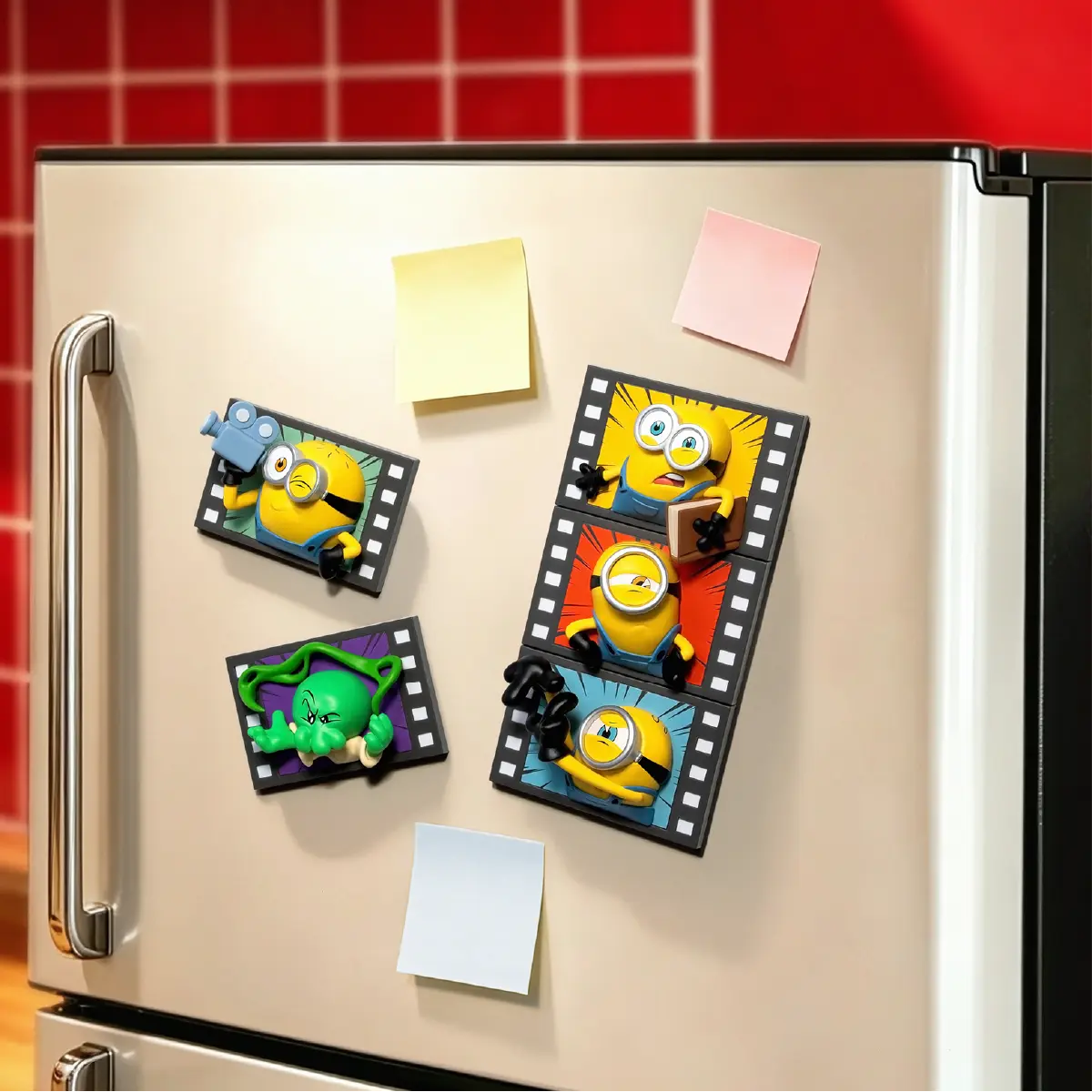 Four Minions & Monsters Action character magnets attached to a refrigerator door