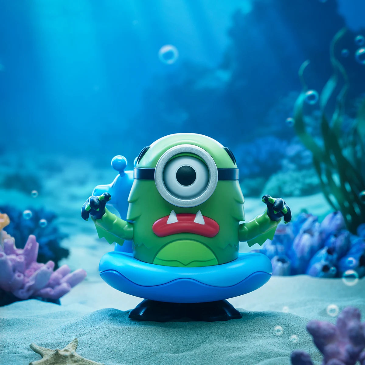 Creature Mel, the green one-eyed lake-monster Minion in a blue swim ring underwater, Minion Monsters
