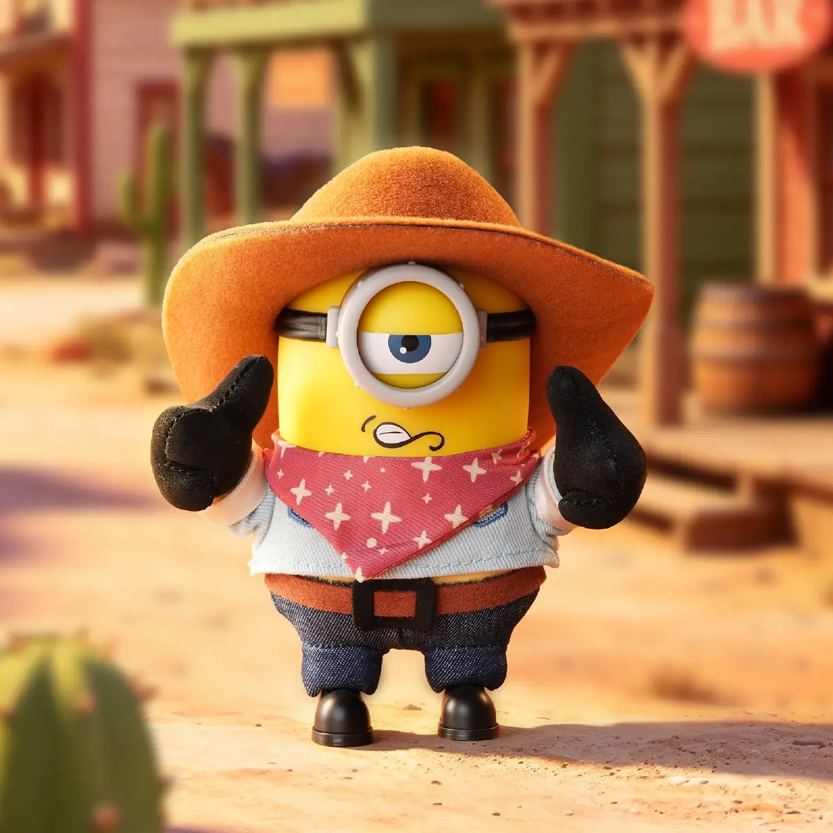 Cowboy James Minion plush in a brown hat and red bandana on a western street