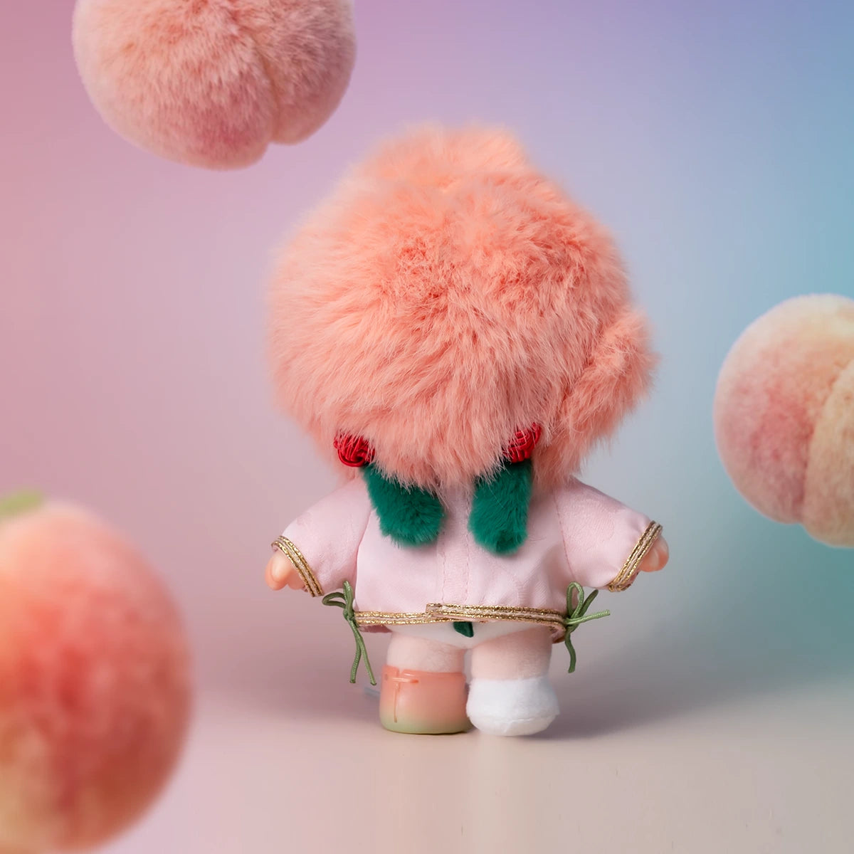 Back of NINNIC Fairy Peach plush showing fluffy peach wig, green leaf bangs and pink robe, peach-fairy series