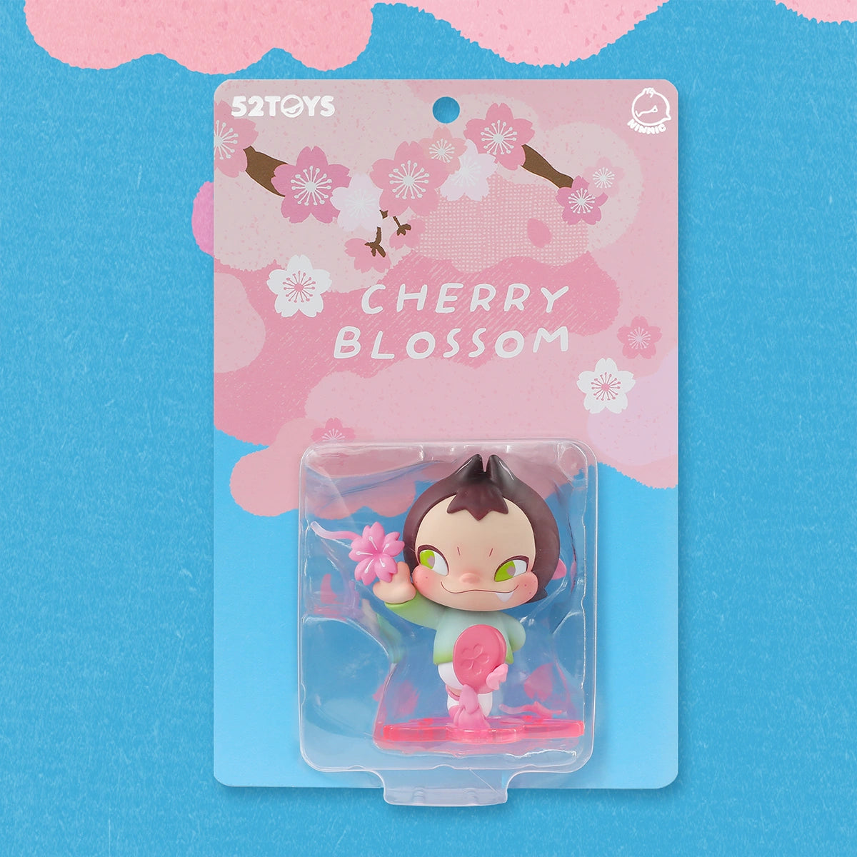 NINNIC Cherry Blossom figure on its blister card against a sakura cloud background
