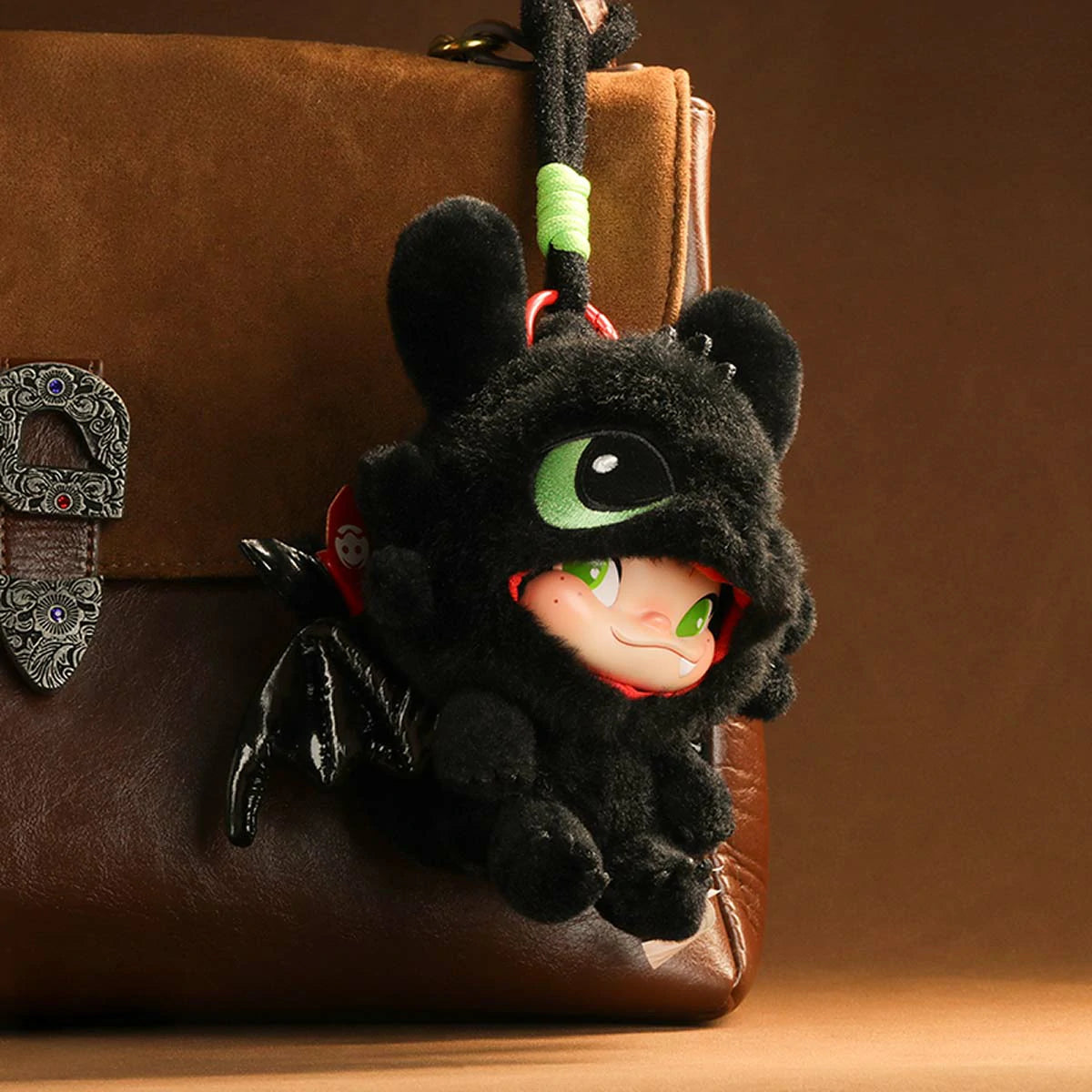 NINNIC as Toothless plush keychain hanging from a brown leather bag, limited edition