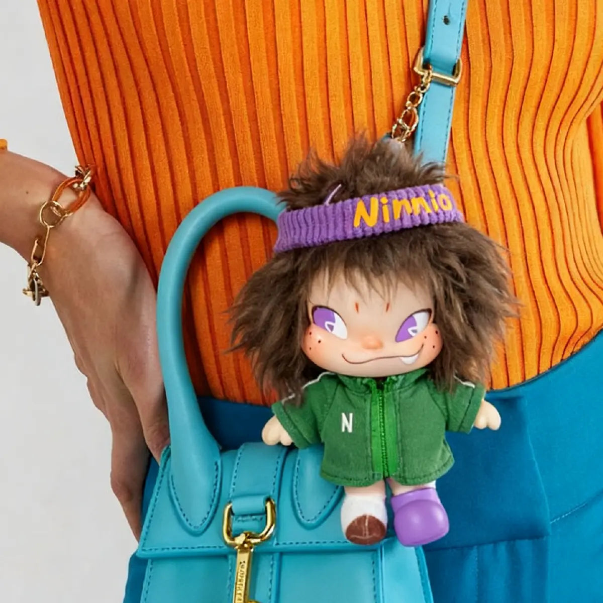 Green NINNIC Wild & Free plush keychain blind box packaging showing figure lineup