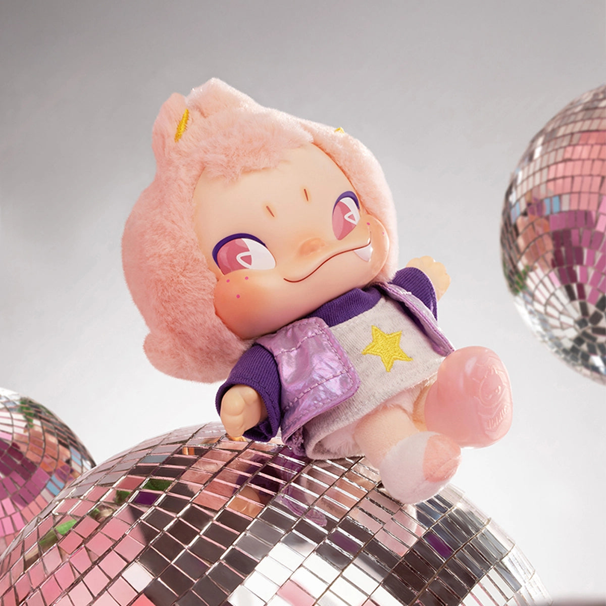 Ramune Collector NINNIC with pink hair and lavender jacket on a disco ball, NINNIC Wild & Free
