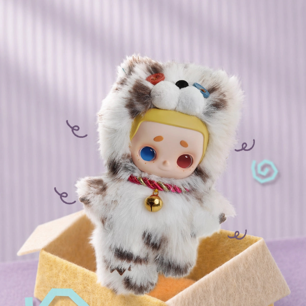 NOOK plush in a white tabby cat costume with bell collar standing in a box
