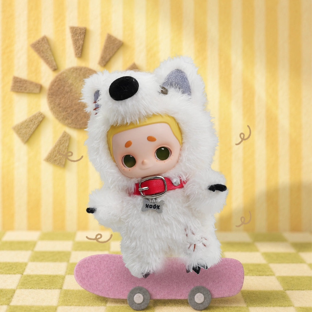 NOOK plush in a white dog costume riding a pink skateboard