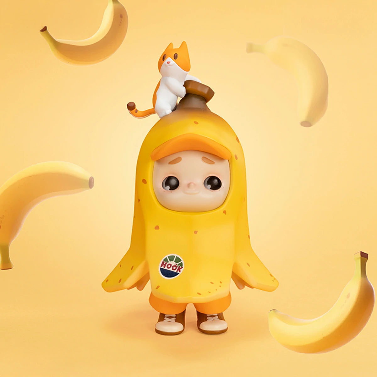 NOOK Bananana 120% figure with kitten on banana stem amid bananas, limited edition