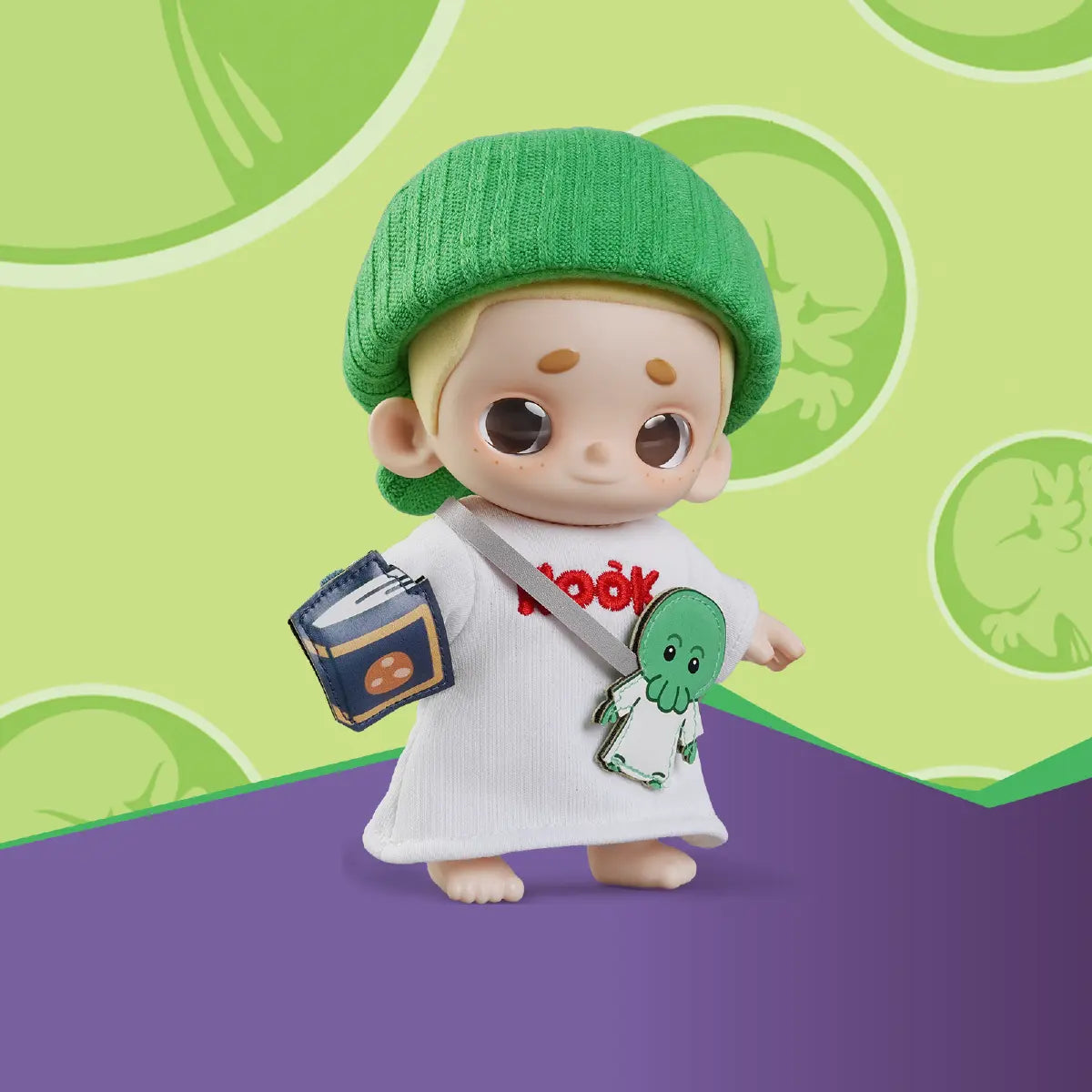 NOOK Goomi plush figure posed against a green graphic background