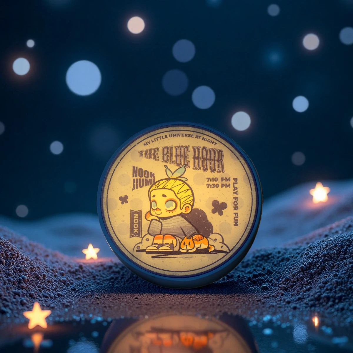 The Blue Hour round magnet glowing with sleeping NOON JUNI character, NOOK Night Series