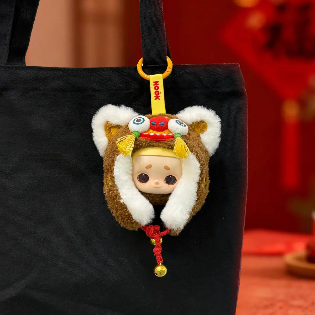 Orange and brown Tiger-Head Hat Nook charms side by side under New Year banners in snow