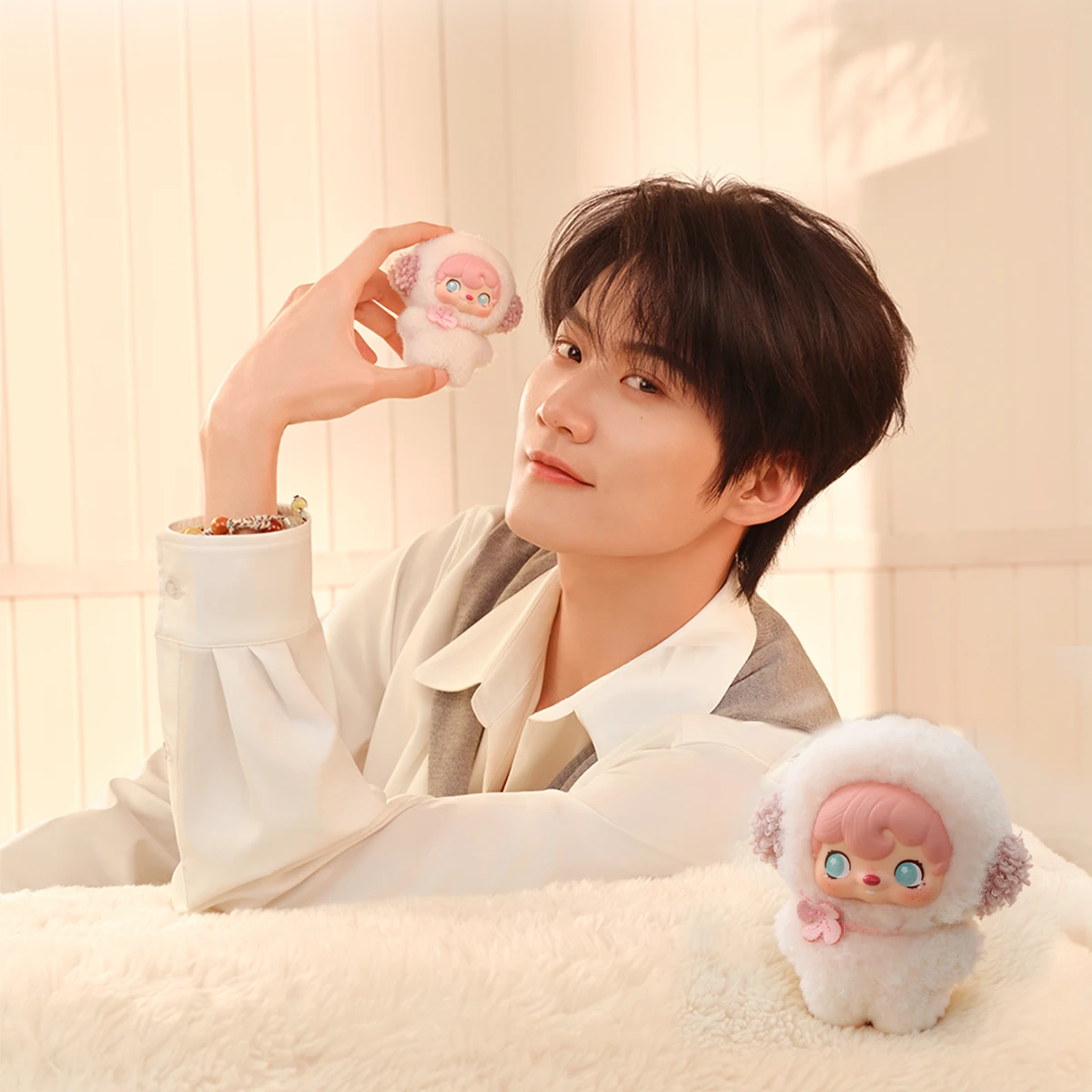 Ambassador Zhou Keyu holding pink and Cosmos pixie plushes, POUKAPOUKA Pocket Cosmos by 52TOYS