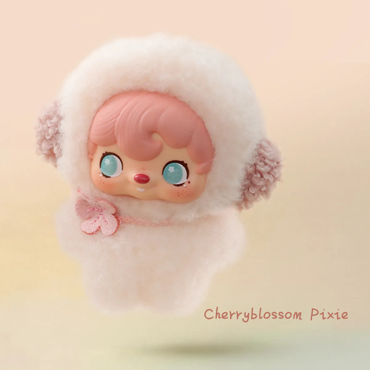 Cherryblossom Pixie in a pale pink hood with lilac pom ears and blossom charm, Pocket Cosmos by 52TOYS
