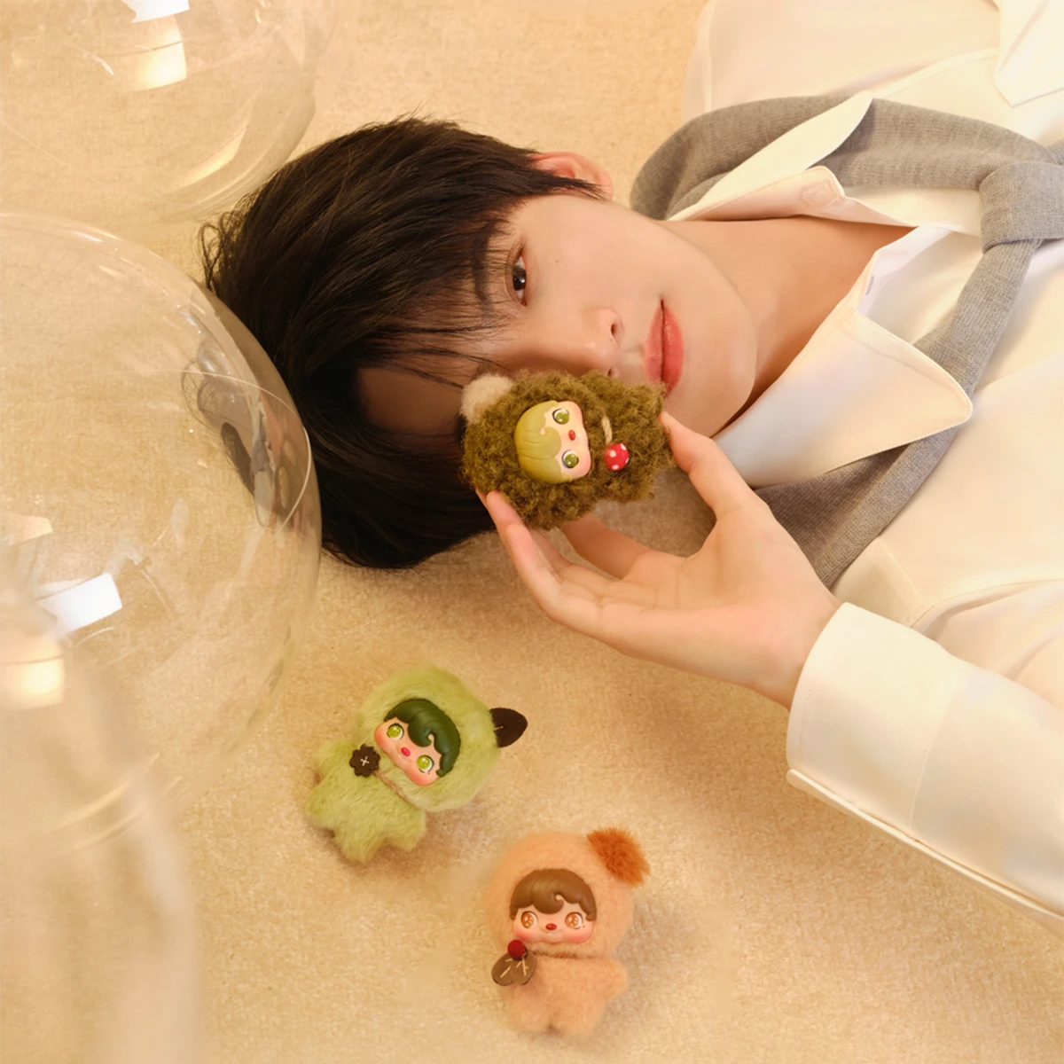 Ambassador Zhou Keyu posed beside Greenfield and Autumnleaf Pixie plushes, Pocket Cosmos by 52TOYS