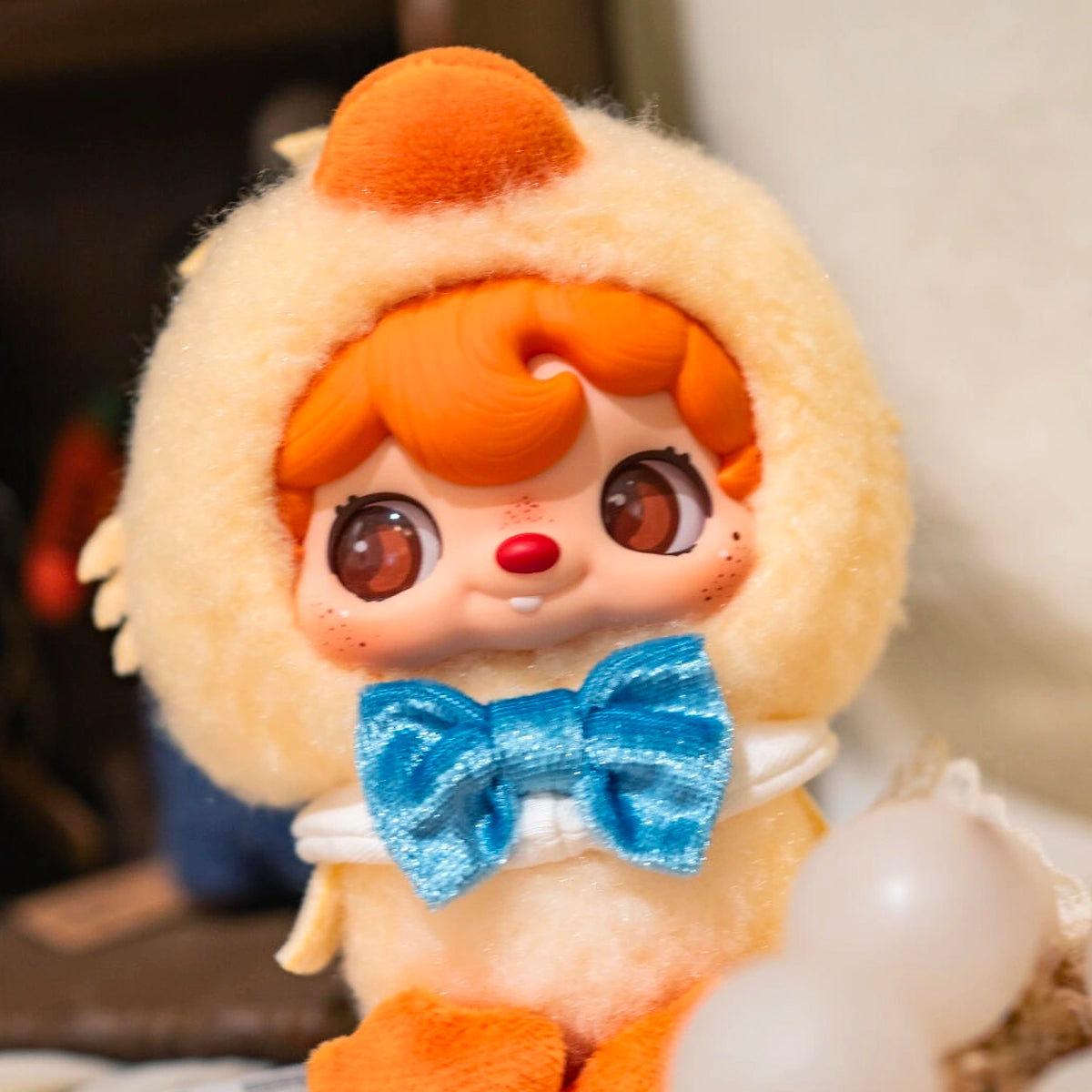 Close portrait of POUKAPOUKA in a Quacker duck costume with blue bow tie