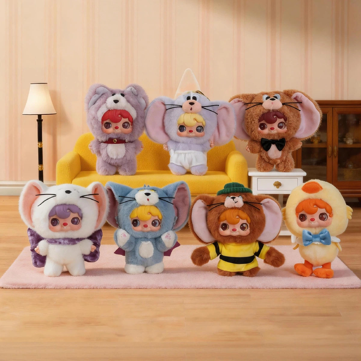 Complete POUKAPOUKA x Tom and Jerry plush lineup arranged on and in front of a yellow sofa