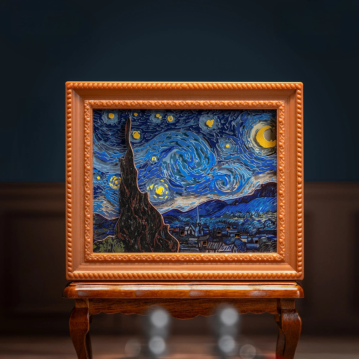 The Starry Night swirling-sky diorama in orange frame on a wooden stand, QueSera Living Paintings