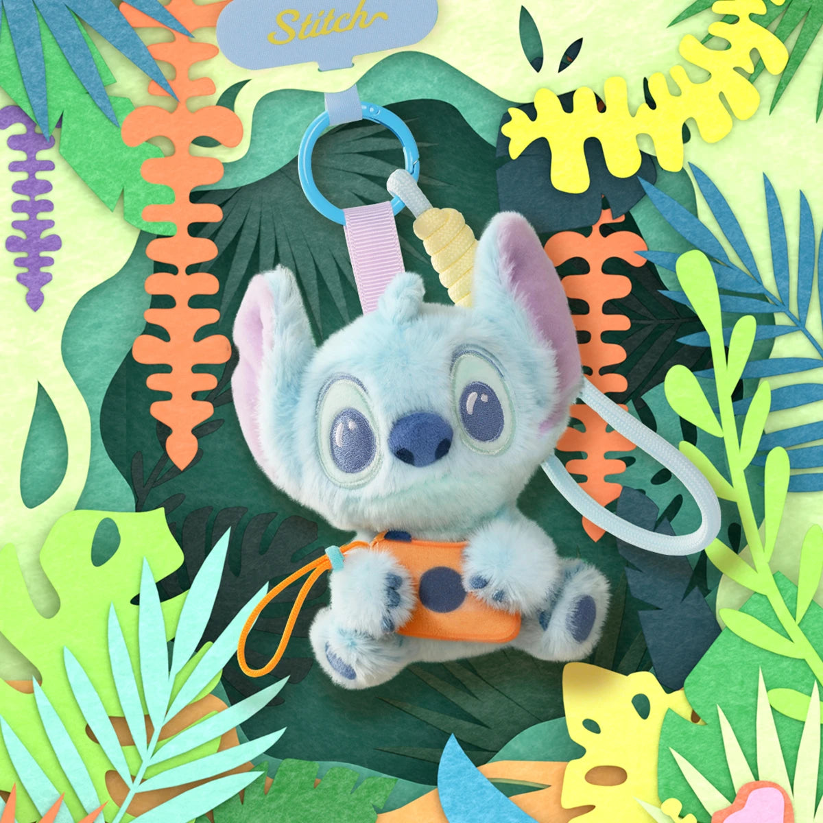 Stitch plush phone strap holding an orange camera in a tropical foliage scene
