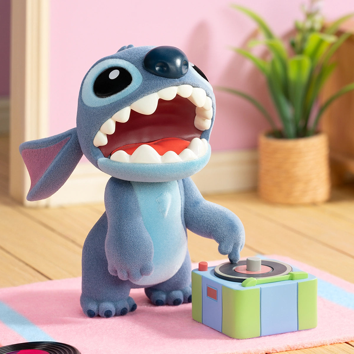 Stitch shouting beside a colorful record player in a living room