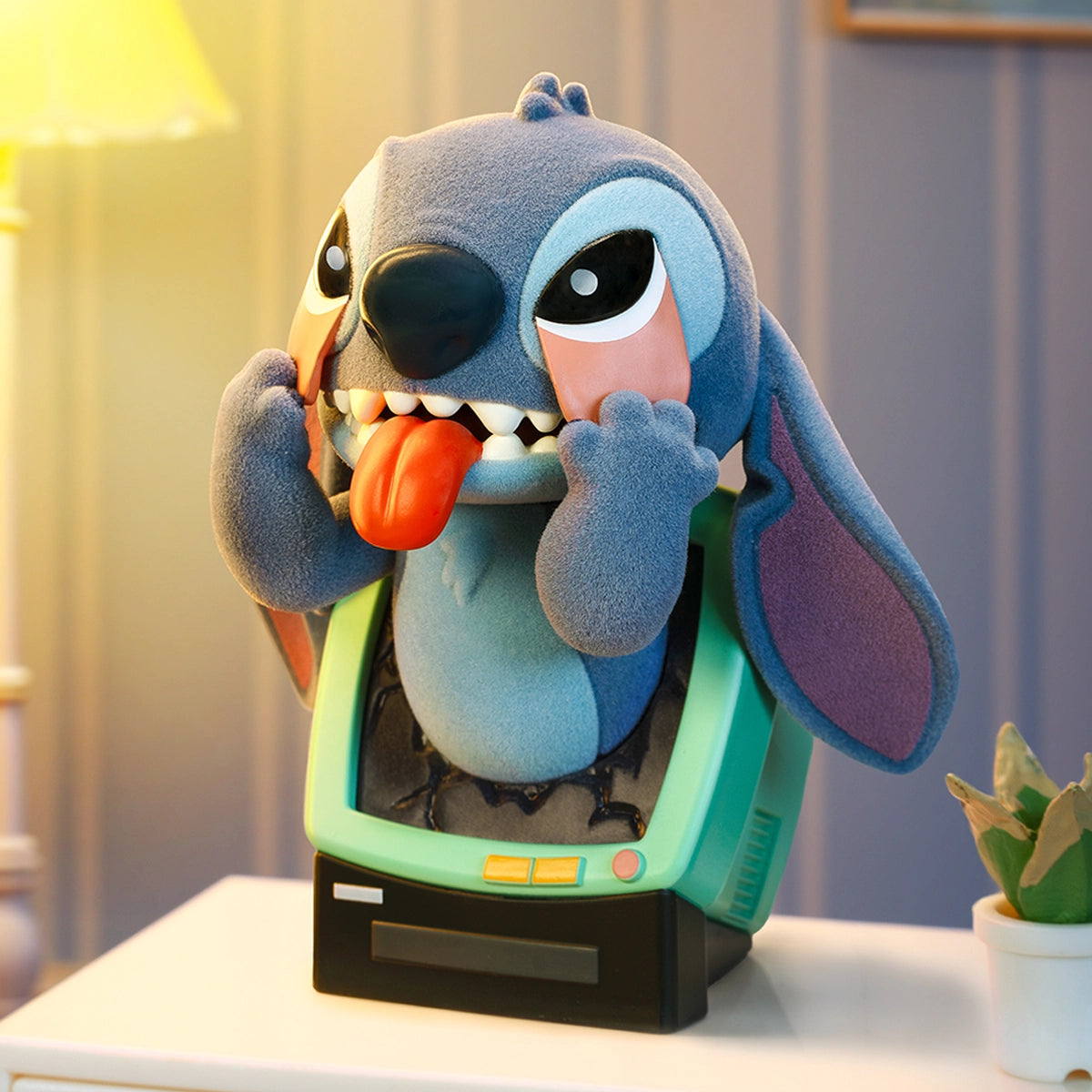 Stitch climbing out of a green computer monitor and pulling down his eyelids