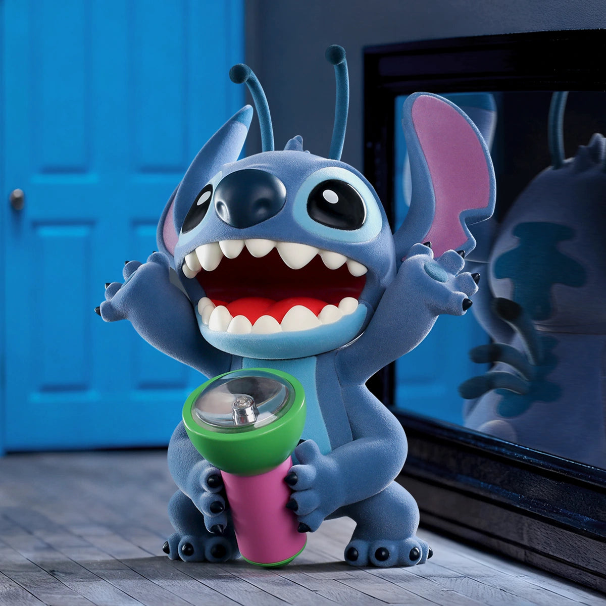 Stitch Flashlight Fright figure holding a green and pink flashlight in a dark blue room