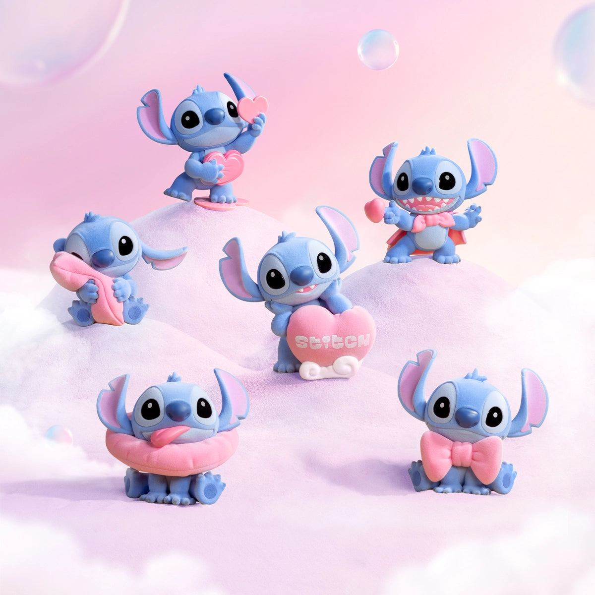 Six Stitch Sweet Pink figures arranged on pink clouds with bubbles