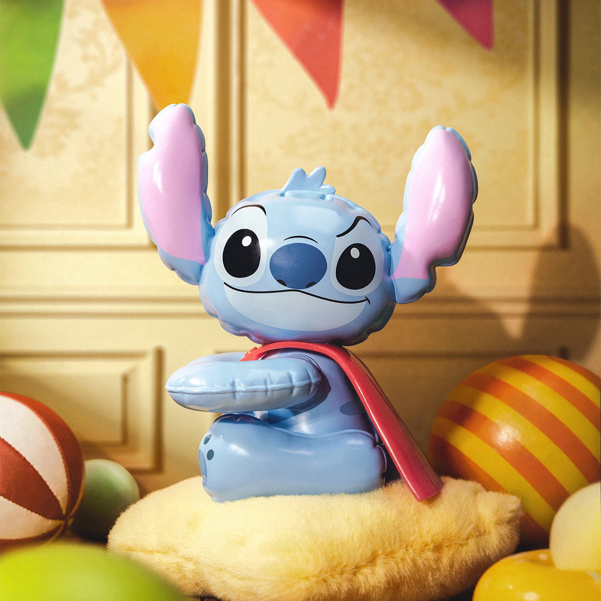 Stitch riding a vintage spring horse while wearing a red cape