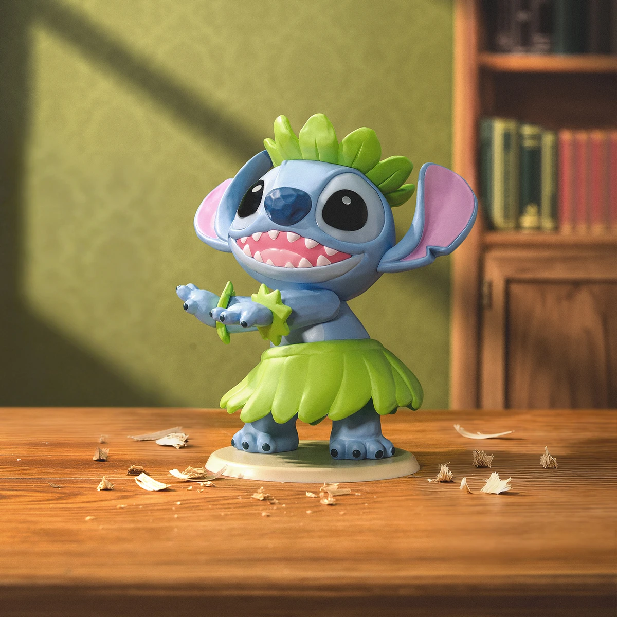 Stitch dressed as a hula dancer with green skirt and leaf crown