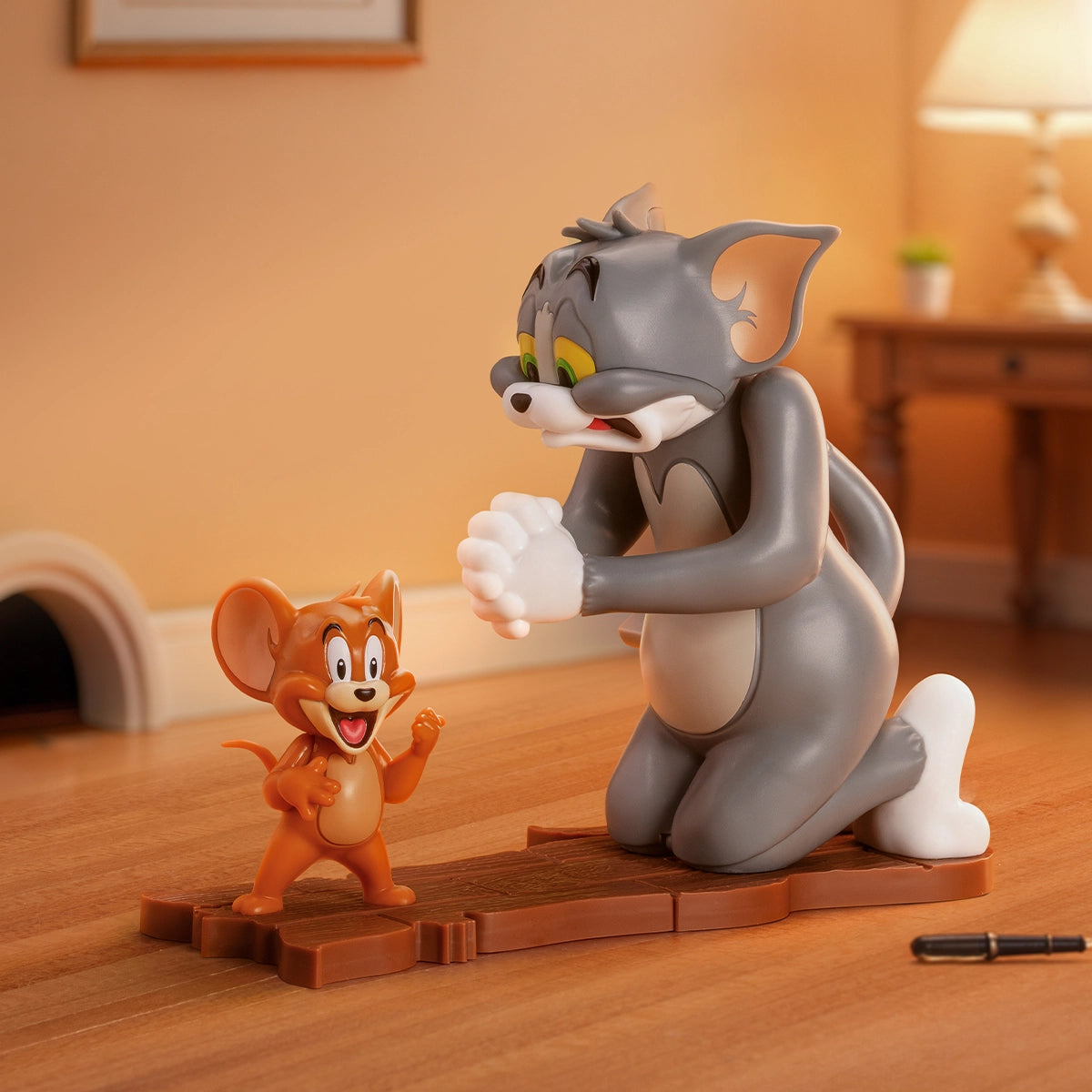 Begging for Mercy, gray Tom kneeling with clasped paws as laughing Jerry stands by, Tom and Jerry Inseparable Chaos