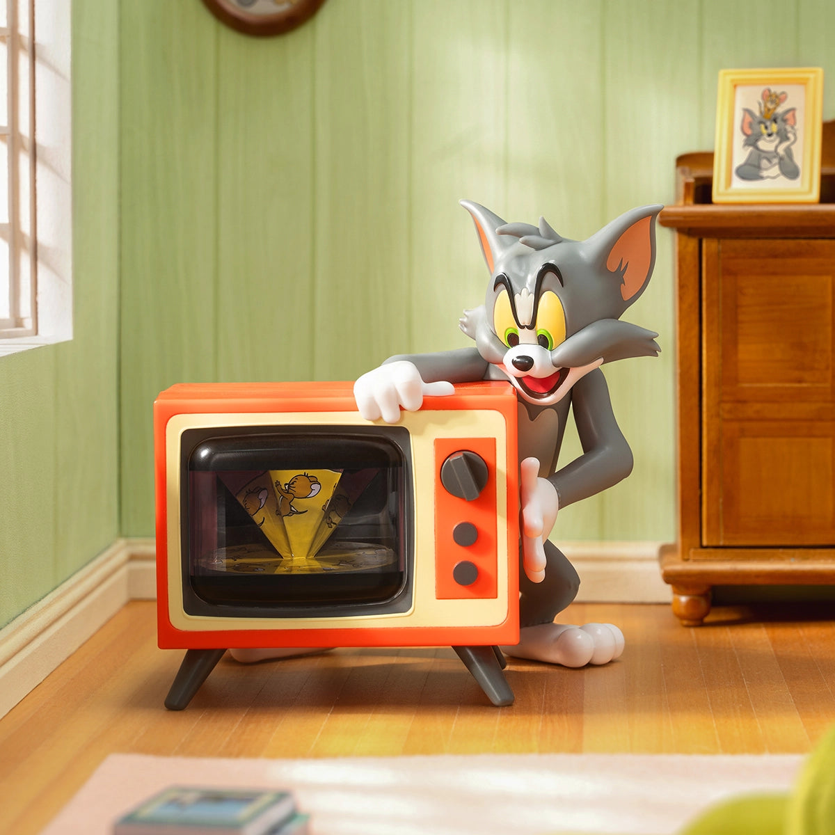 No Escape, grinning Tom over a vintage orange TV as Jerry runs across the screen, Tom and Jerry