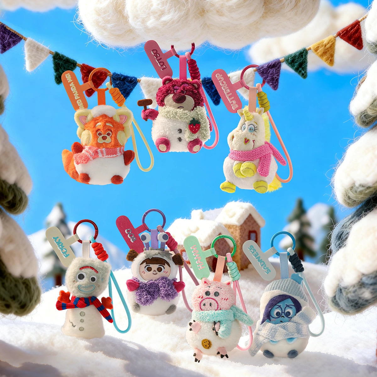 Seven Disney and Pixar Winter Snow Globe plush phone charms hanging in a snowy village scene