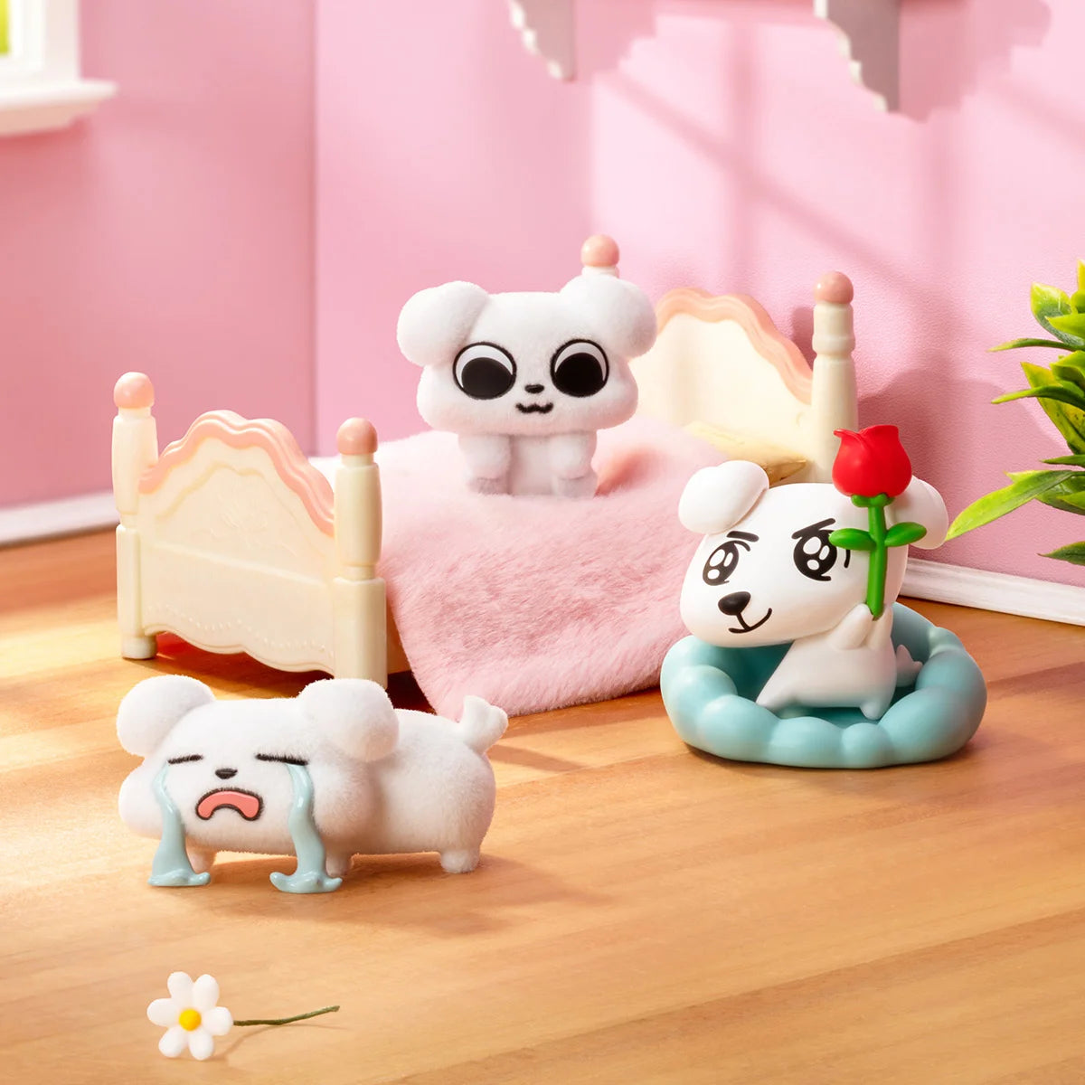 Zoggy dog figures in a pink bedroom including Starving collapsed and Rose For You, So Cute
